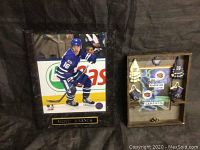 Photo of Mitch Marner framed plaque showing player in action on ice in blue Toronto Maple Leafs uniform.