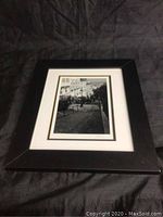 Framed photo showing the entire piece including black frame and white matting, image of Montmartre steps visible.