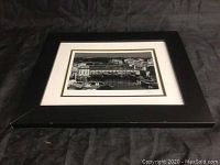 Framed black and white photo showing the full frame and mat with view of Ponte Vecchio.