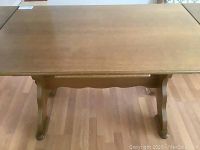 Top view of the banquette table showing the wooden surface and size.