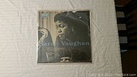 Front cover of Sarah Vaughan vinyl record showing a black and white photo of the artist with text overlay.
