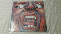 Front cover of King Crimson vinyl record showing the iconic screaming face artwork.