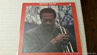 Front cover of Woody Shaw vinyl record showing Woody Shaw holding a trumpet.