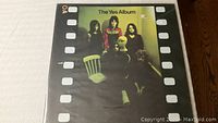 Front cover of The Yes Album vinyl record showing band members and filmstrip border design.