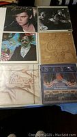 Six LP album sleeves including Paul Young – No Parlez, two Chicago titles and Styx – Paradise Theatre