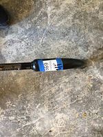 Close-up photo of the blower vac handle and cord area, showing black nozzle and part of the red body.