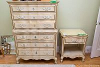 Front view of vintage highboy dresser and side table together showing drawers, hardware, and condition.
