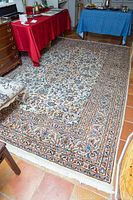 Full-floor view of cream background rug under furniture