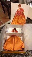 Limited Edition Couture Barbie doll in original box with decorative illustration sleeve, doll still inside.
