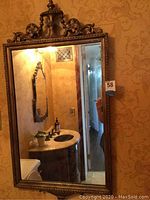 Full view of entire mirror showing its size and reflective quality.