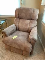 Front angled view showing overall condition, upholstery color and padding detail of the La Z Boy recliner chair.
