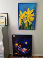 Two paintings shown, one of yellow flowers on blue background, one abstract with guitar and female figure