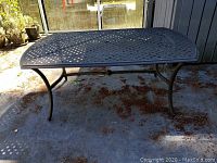 Side view showing lattice top and curved legs