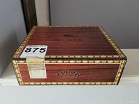 Closed wooden humidor box with Callaway Seymour and Member's Club branding on top outer lid.