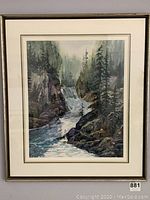 Frontal close-up of framed river scene painting