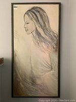 Full view of framed original portrait artwork showing side profile of woman with long hair and soft artistic shading.