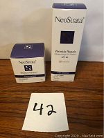 Boxed NeoStrata Moisture Infusion Hydrating Cream and Wrinkle Repair Moisturizing CC Cream with SPF 30 sitting on wood surface, showing front packaging.