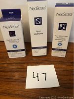 Photo showing three NeoStrata skincare product boxes labeled Youth Factor GF Total Regenerating Multi Anti-Aging Eye Contour Cream, Spot Lightener, and Pore Minimizing Anti-Shine Hydrating Gel.