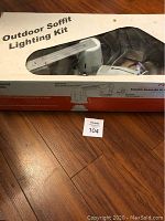 Packaged outdoor soffit lighting kit with visible box label and contents window.