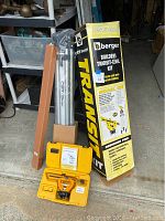 Full lot showing outer packaging box, tripod stand, and transit level case.