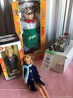 Overview showing all four items in the lot arranged on table with visible boxes and tags