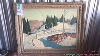 Full frontal view of framed winter landscape painting with auction tag