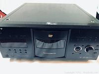 Front view of Sony Megachanger DVD player showing disc drawer and control buttons.