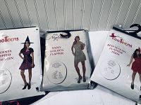 Three packaged Halloween teen costumes: Magenta Ripped Witch, Sassy Golden Flapper, Red Slough Flapper Teen.