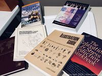 Collection of six books arranged on a white surface, showing titles and cover art for identification.