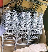 White metal garden edging panels stacked in box