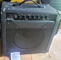 Photo of the Raven KG 20 guitar amplifier front panel and speaker grille, showing all controls and connections.