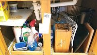 Photo showing various cleaning bottles, including Comet, Clorox bleach, Raid bug spray, dish detergent, dish sponges, and kitchen accessories under the sink.