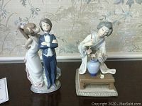 Front view of two Lladro figurines: young couple and Japanese woman with flower arrangement