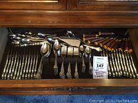 Full drawer view showing Lyon flatware and B. Thomas & Co. steak knives