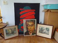 Six paintings displayed together: three smaller framed landscapes and portrait, one large framed abstract painting with red and teal shapes on black background.