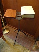 Full view of stand with dictionary open on right panel and empty left panel