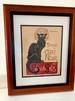 Framed print featuring 'Tournée du Chat Noir' art nouveau cat print by Rodolphe Salis, walnut frame with black trim.