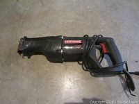 Photo of a black Craftsman Sawzall reciprocating saw with 6.5 amp motor and attached power cord, showing the entire tool from the handle to the blade clamp area.