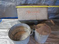 Top view of galvanized tub with 'Beatty' printed on side and tape measure showing width