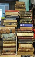 Stack of approx. 47 old books in various leather and cloth bindings