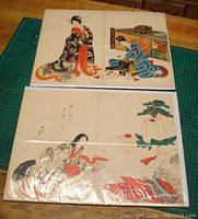 Full view photo of both prints, showing them laid out with visible vertical seams at center, including the woman kneeling near bonsai and the two women indoor scene