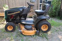 Side view of tractor showing body panels, deck and steering wheel