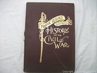 Front cover of the oversized hardcover book with gold embossed title and sword illustration.