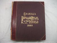 Front cover of the 1888 Caskell's Popular Atlas of the World showing brown leather with gold lettering.
