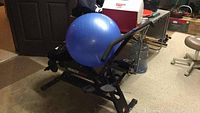 Health Rider exercise machine with blue exercise ball on top.