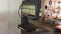 Front view of Craftsman band saw-sander showing table, blade and power cord