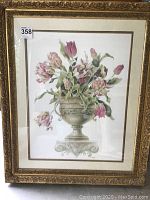 Framed print of floral arrangement in ornate gold-tone frame, showing full piece and size.