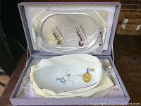 Set in molded box with serving tray and holder visible.