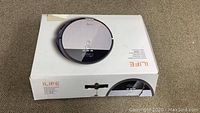 iLife V8S robot vacuum and original box with product image and logo
