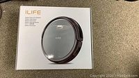 Closed box showing the ILIFE robotic vacuum cleaner image and branding.